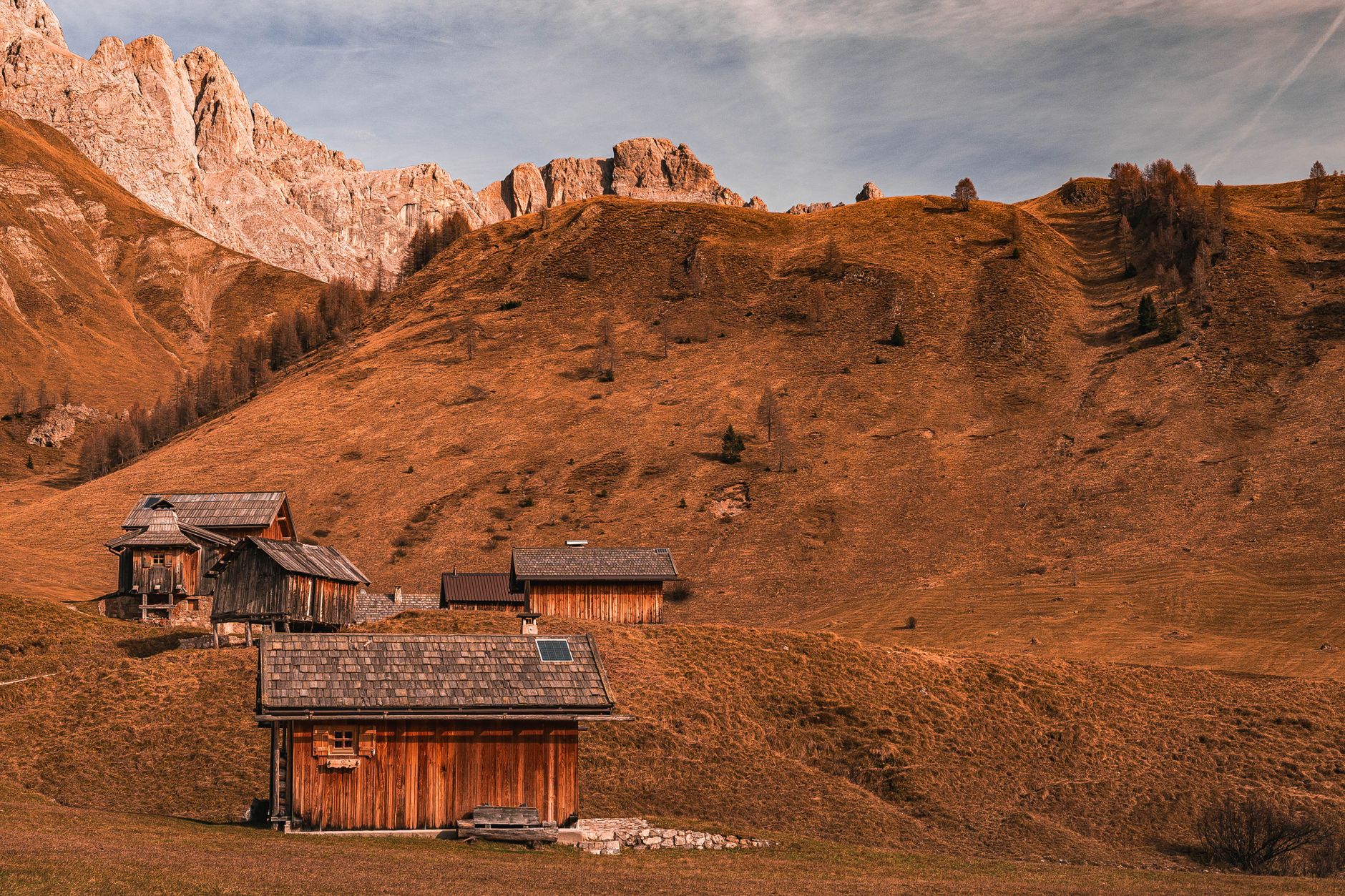 Italian Dolomites mountain peak with wooden refuge